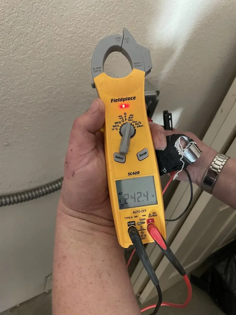 Voltage testing with clamp meter during Outlet Installation in Redan